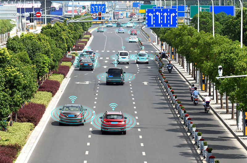 cars on the road with wireless signals around them